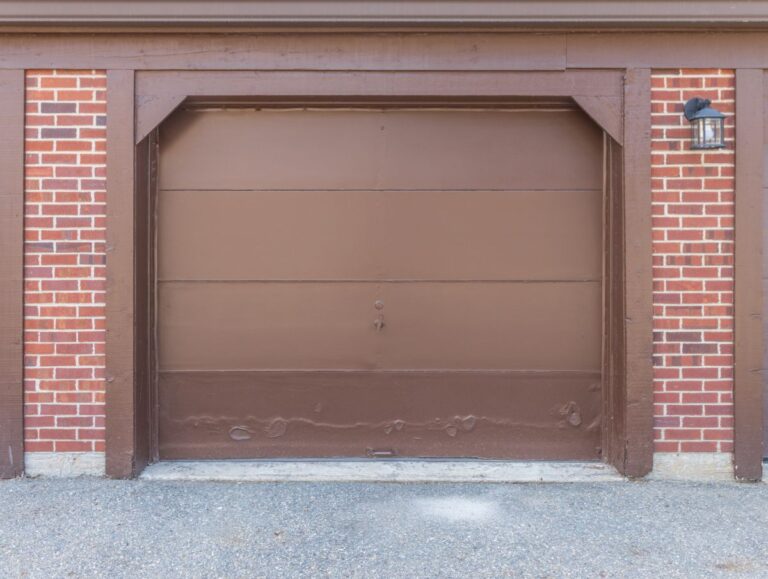 A garage door with a dent